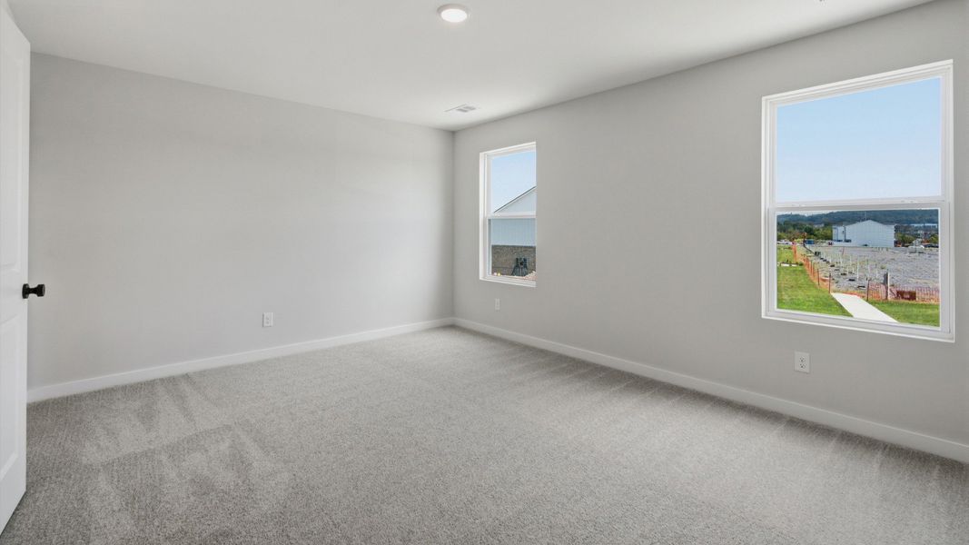 Primary room with connected bathroom and walk-in closet