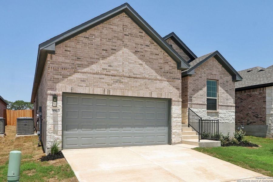 Front exterior of a new home in Arcadia Ridge - Premier Series, San Antonio, TX, highlighting curb appeal (Image 17). Front exterior of a new home in Arcadia Ridge - Premier Series, San Antonio, TX, highlighting curb appeal (Image 17).
