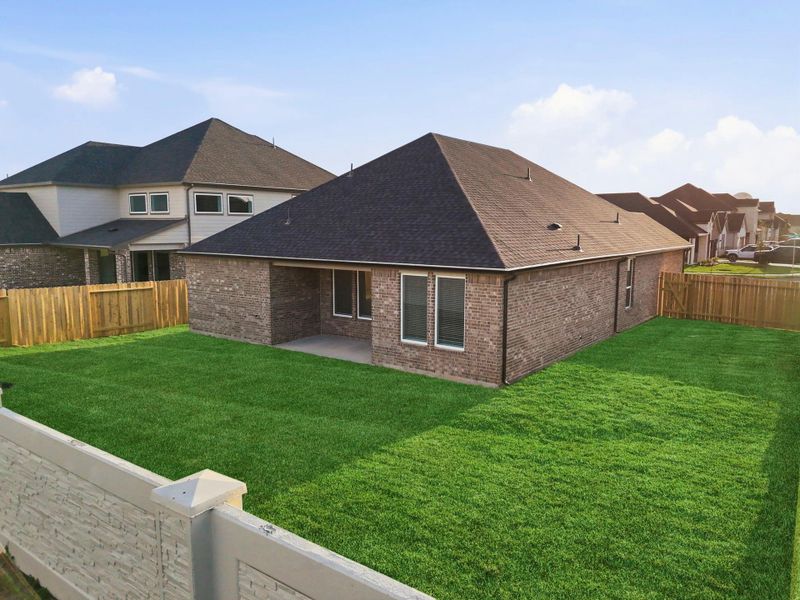 Exterior details and patio area of a home in Alexander 55' Homesites, Pearland (Image 2).