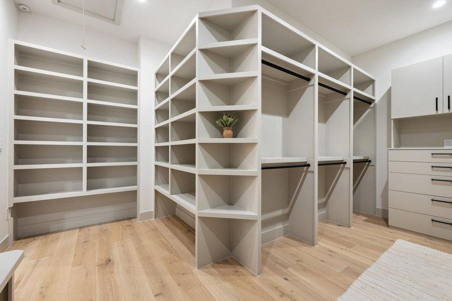 Custom, walk-in, primary closet.
