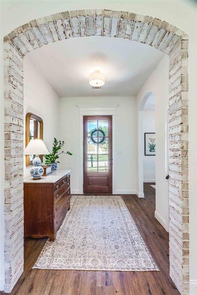 Foyer with dark wood-type flooring