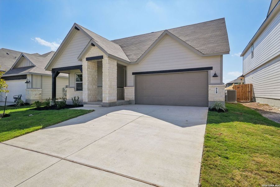 Front exterior of a new home in Estancia Ranch - Classic Series, San Antonio, TX, highlighting curb appeal (Image 20).