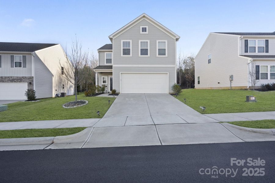 Front exterior of a new home in Martha's Ridge, Statesville, NC, highlighting curb appeal (Image 1). Front exterior of a new home in Martha's Ridge, Statesville, NC, highlighting curb appeal (Image 1).