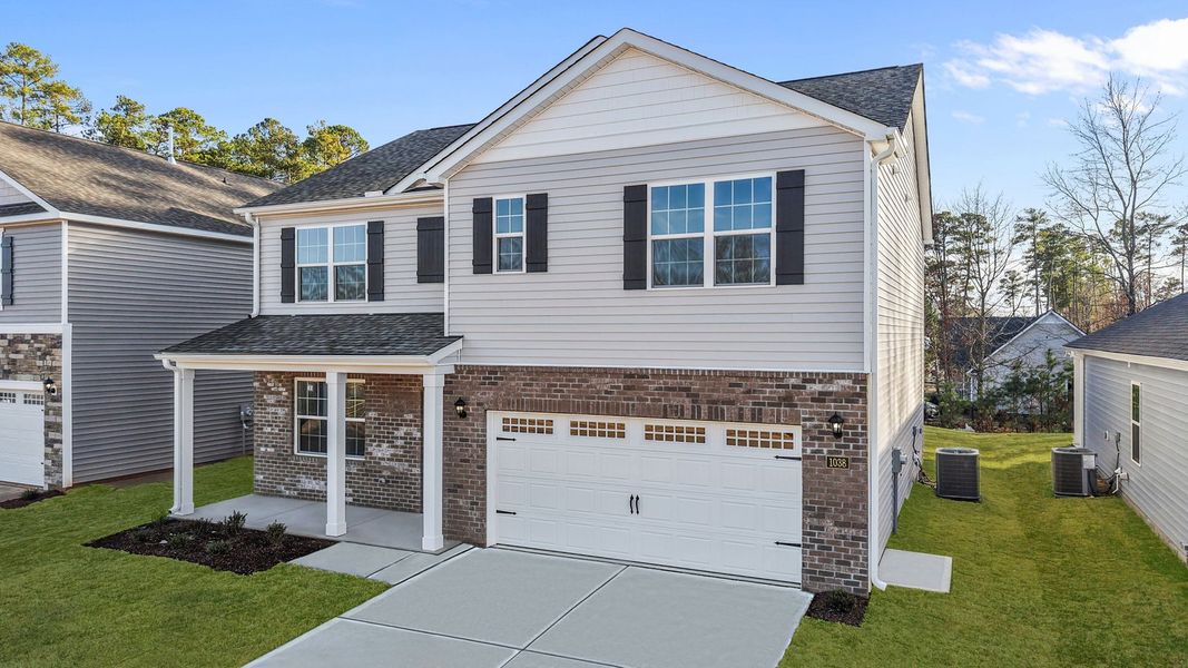 Front exterior of a new home in Bedford Place, Wilson, NC, highlighting curb appeal (Image 21).