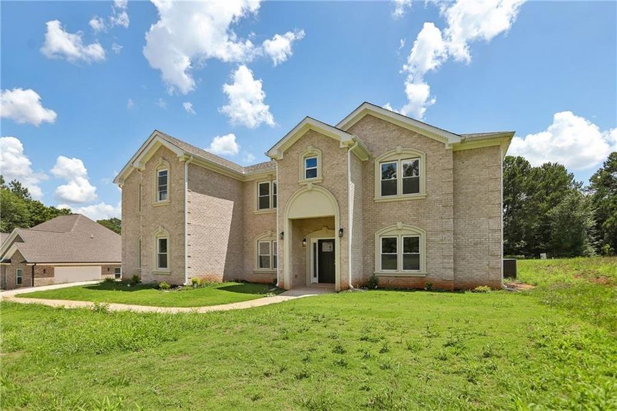 Front exterior of a new home in , Covington, GA, highlighting curb appeal (Image 20).