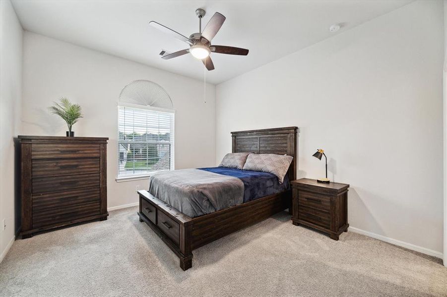 Secondary upstairs bedroom with an ensuite that is also open to the game-room.