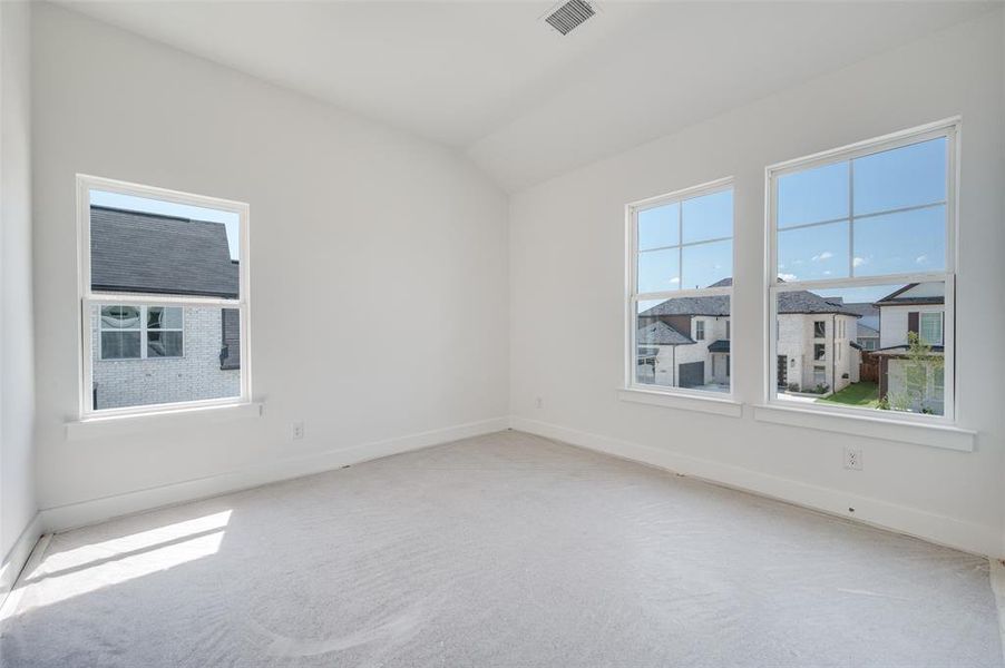 Carpeted empty room with plenty of natural light