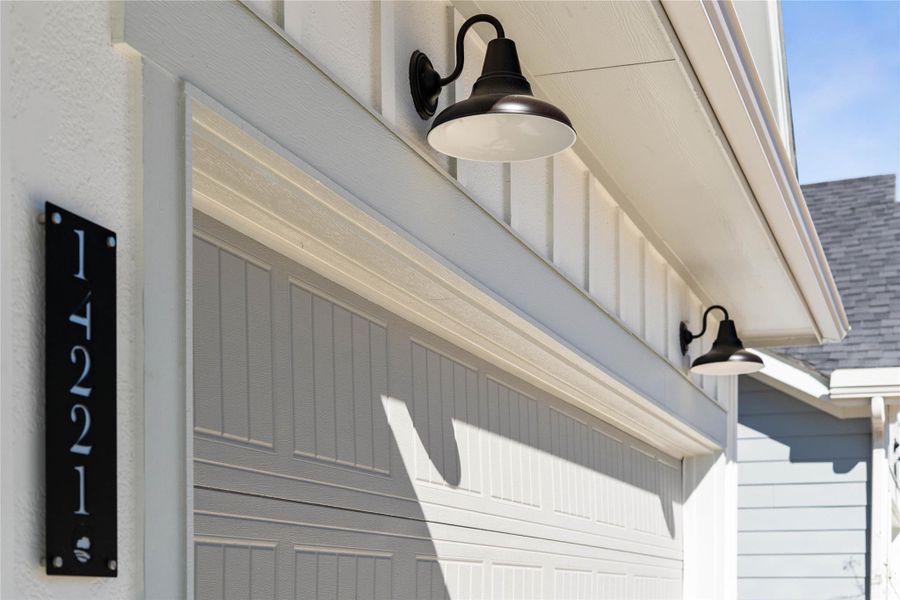 The property features stylish matte black gooseneck barn lights - providing ample illumination for safety and ambiance.