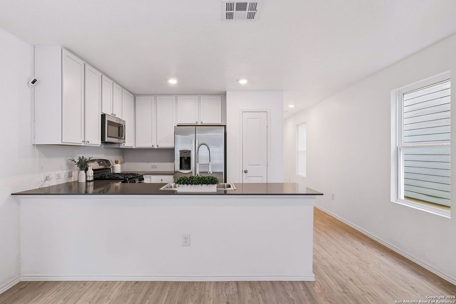 Furnished interior view inside a new home in Aston Park: Wellton Collection, San Antonio (Image 8).