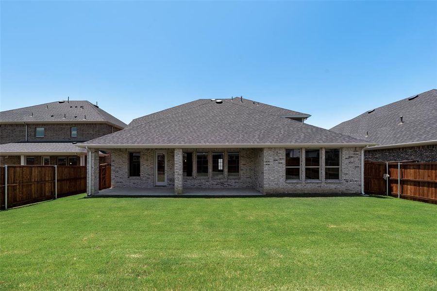 Front exterior of a new home in Valencia On The Lake, Little Elm, TX, highlighting curb appeal (Image 20).