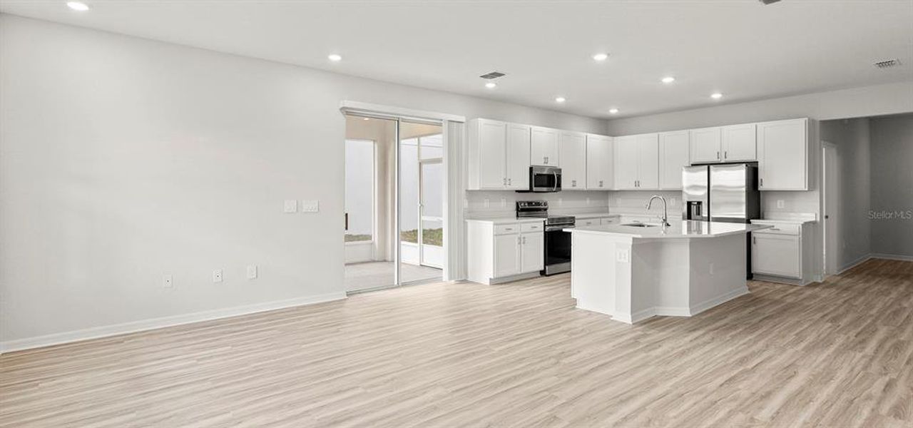 Furnished interior view inside a new home in Estates at Hickory Cove - Bungalows, St. Cloud (Image 12).
