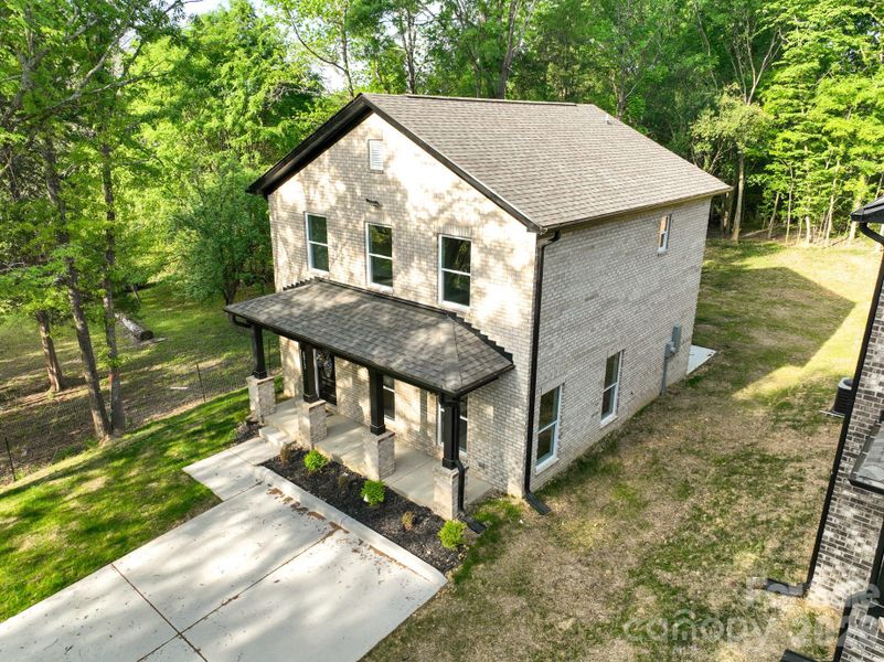 Front exterior of a new home in , Albemarle, NC, highlighting curb appeal (Image 23).