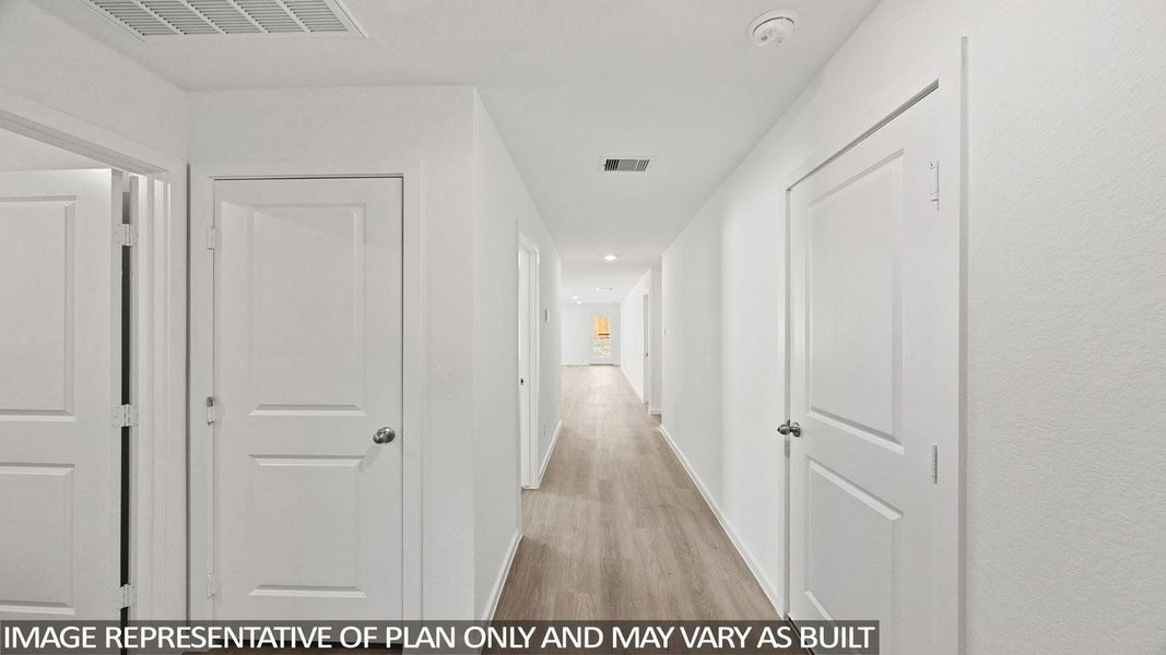 Hallway featuring light wood-style floors and recessed lighting