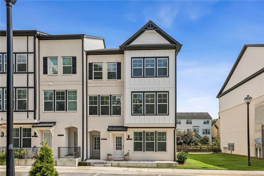 Front exterior of a new home in Town Center Overlook, Peachtree Corners, GA, highlighting curb appeal (Image 26).