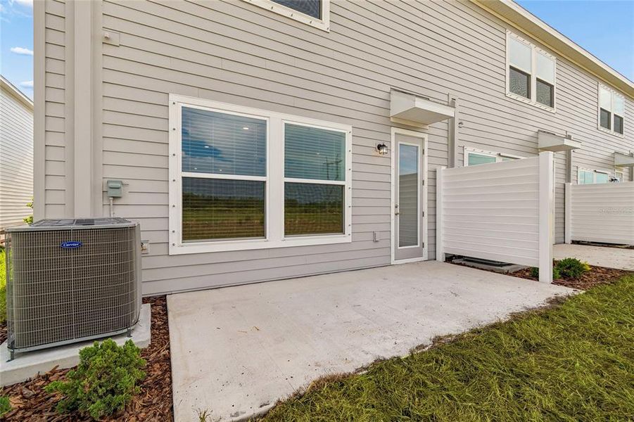 Exterior details and patio area of a home in Waterset Townhomes, Apollo Beach (Image 4).