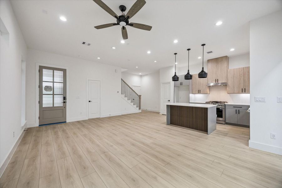 Spacious open living and kitchen layout with polished designer appeal Spacious open living and kitchen layout with polished designer appeal
