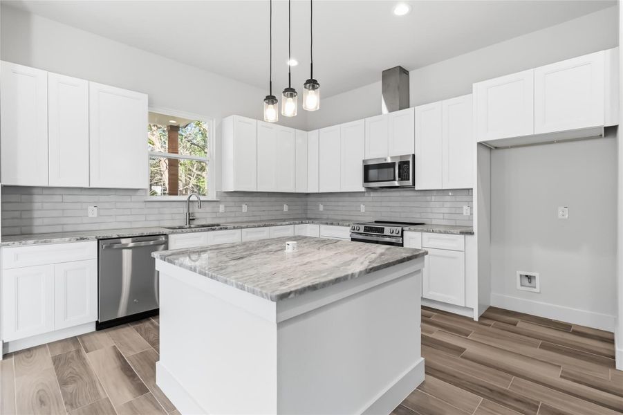 Kitchen island with pop-up outlet