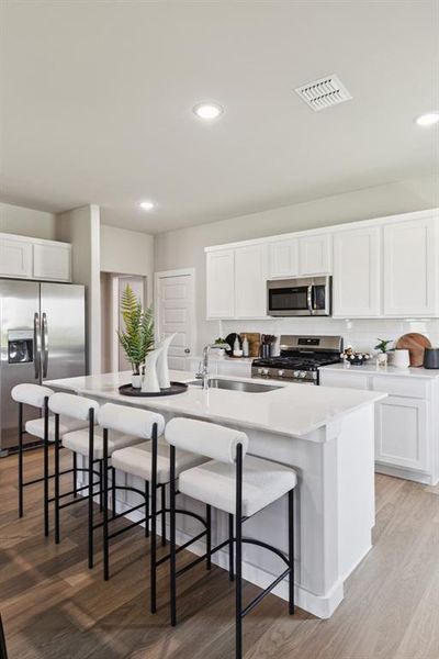 Kitchen in the Magnolia home plan by Trophy Signature Homes – REPRESENTATIVE PHOTO