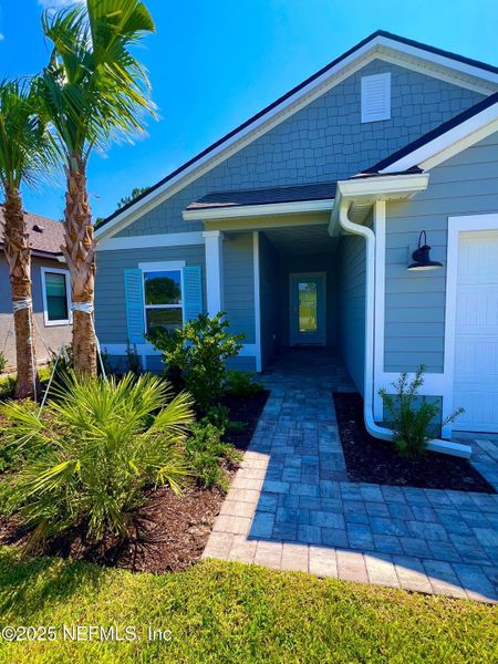 Exterior details and patio area of a home in American Village, Palm Coast (Image 3).