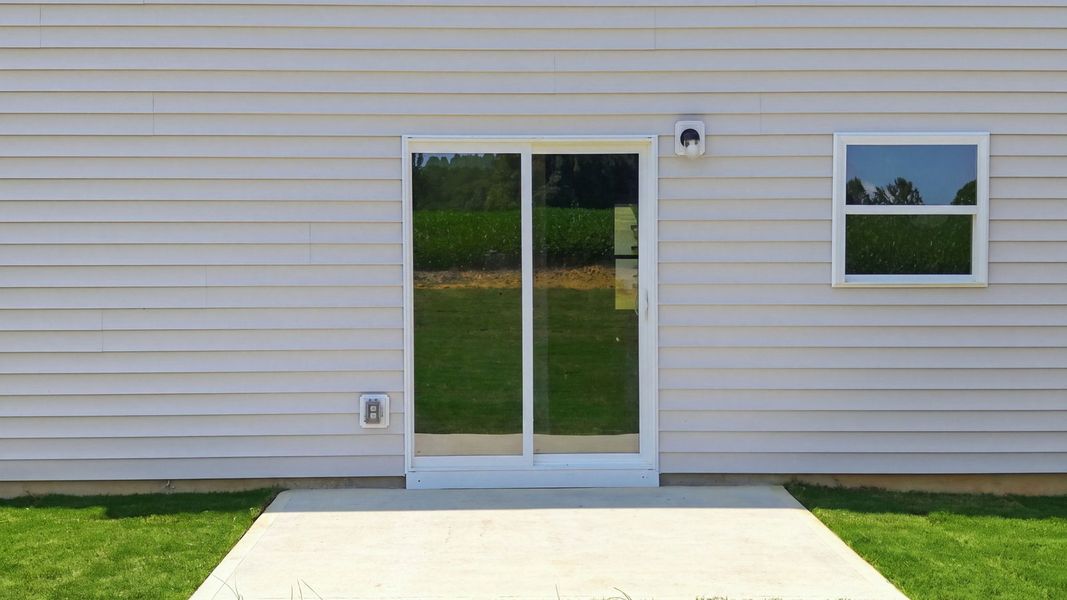 Exterior details and patio area of a home in Hobbs Farm, Ayden (Image 20).