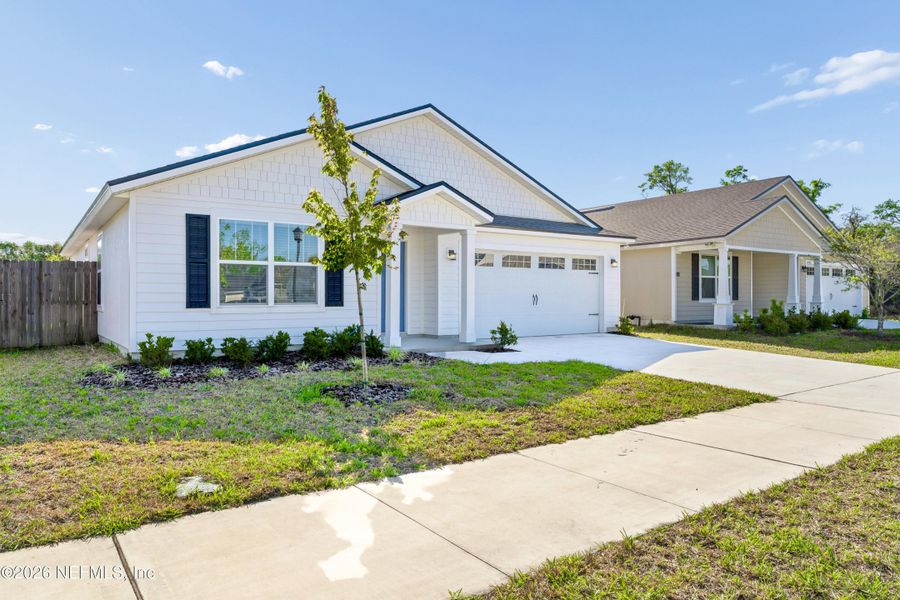 Front exterior of a new home in , Jacksonville, FL, highlighting curb appeal (Image 16).