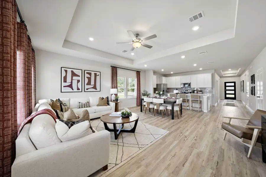 A living room with a wood floor.