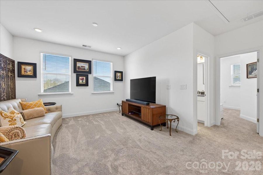 Loft/flex space with recessed lighting.
