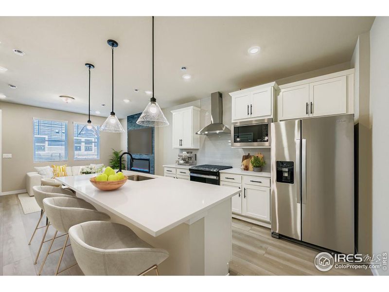 Chef's kitchen with chimney hood, gas range, all stainless!