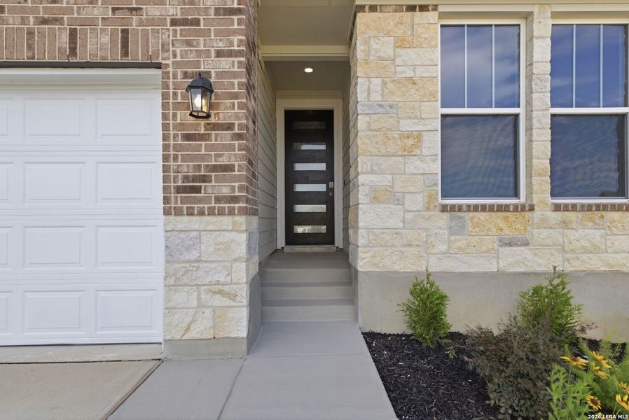 Exterior details and patio area of a home in The Meadows at Hunters Ranch, San Antonio (Image 4).