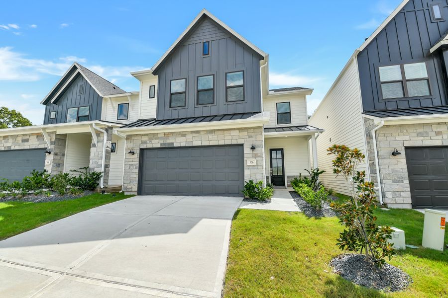 Front exterior of a new home in Summer Place  35', Montgomery, TX, highlighting curb appeal (Image 28).