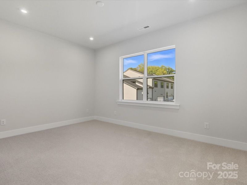Secondary Bedroom with 9' Ceilings.