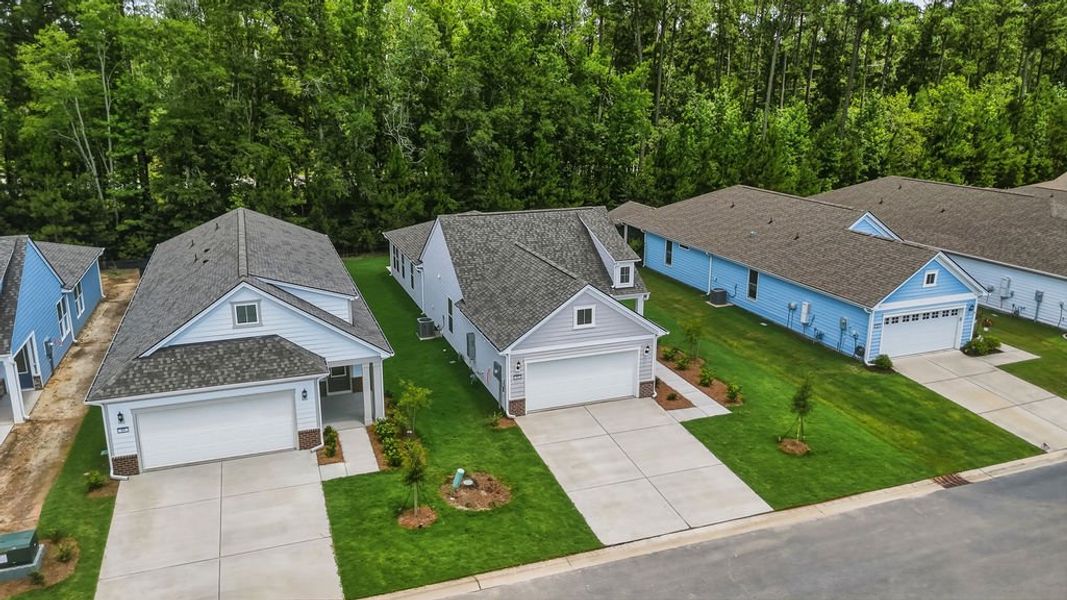 Front exterior of a new home in Sun City Hilton Head, Bluffton, SC, highlighting curb appeal (Image 1). Front exterior of a new home in Sun City Hilton Head, Bluffton, SC, highlighting curb appeal (Image 1).