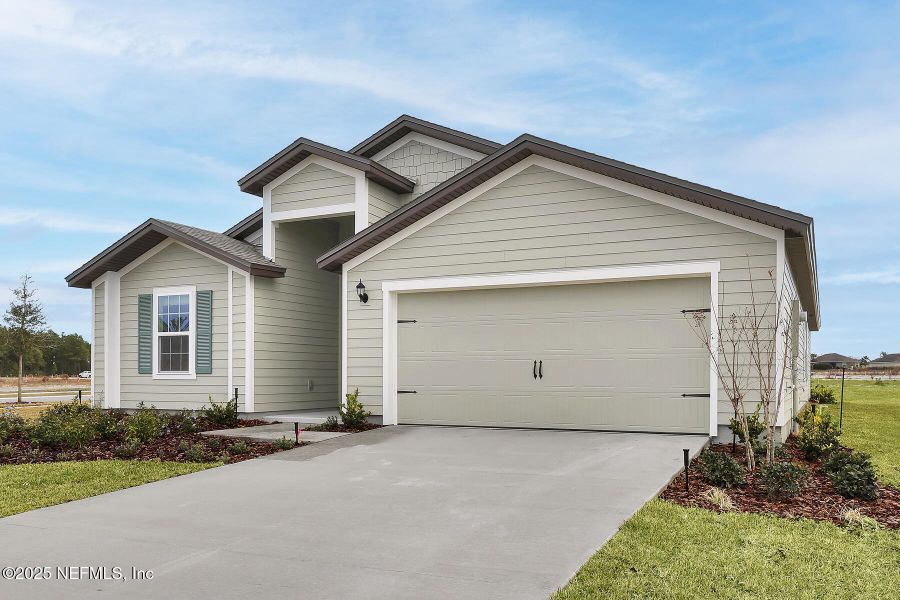 Front exterior of a new home in Rolling Hills, Green Cove Springs, FL, highlighting curb appeal (Image 1). Front exterior of a new home in Rolling Hills, Green Cove Springs, FL, highlighting curb appeal (Image 1).