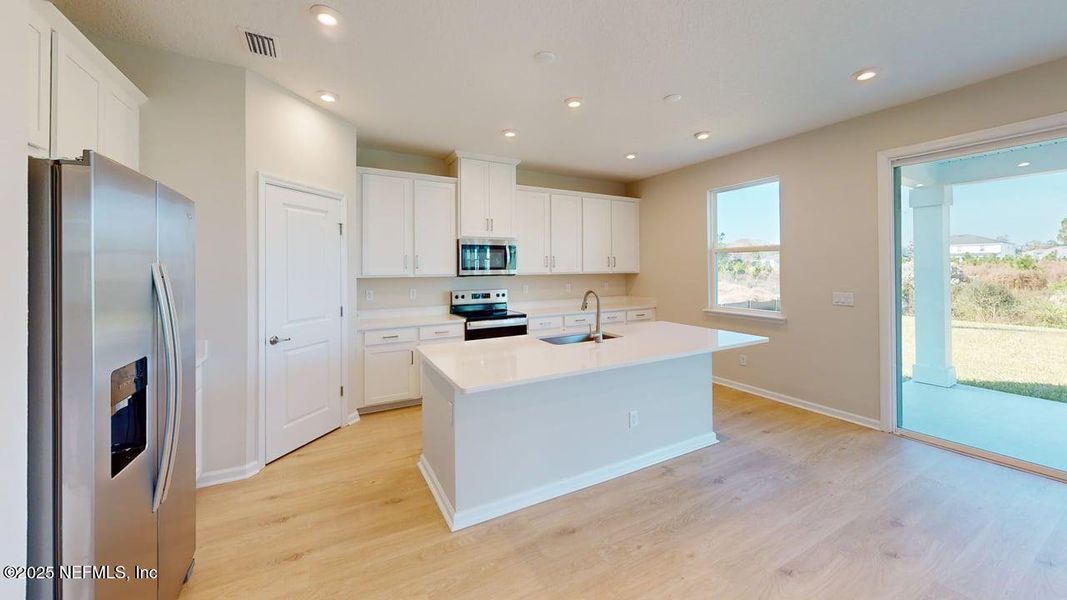 Furnished interior view inside a new home in Lakes at Bella Lago, Green Cove Springs (Image 7). Furnished interior view inside a new home in Lakes at Bella Lago, Green Cove Springs (Image 7).