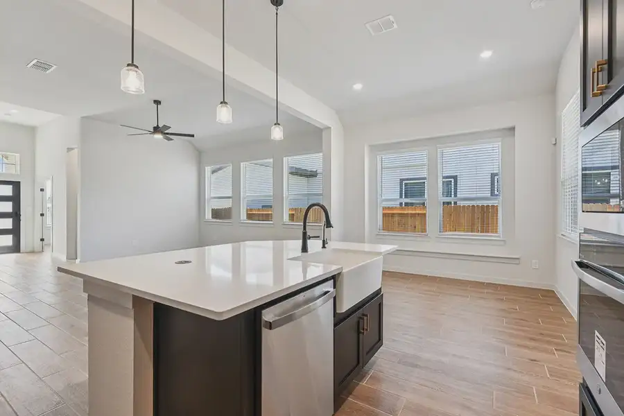 Representative furnished interior of a home built from the Rhyan by Chesmar Homes in Stream Waters, Seguin (Image 7).