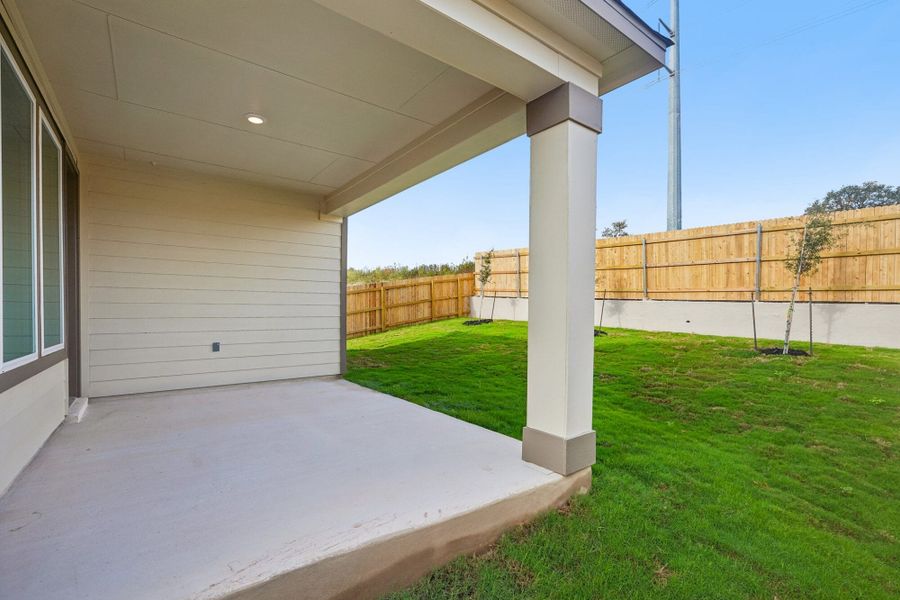 Exterior details and patio area of a home in The Meadows at Hunters Ranch, San Antonio (Image 3).