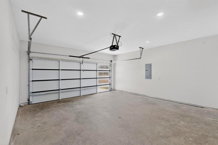 Garage with electric panel and recessed lighting Garage with electric panel and recessed lighting