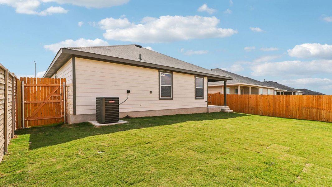 Exterior details and patio area of a home in Monarch Ranch, Manor (Image 19).