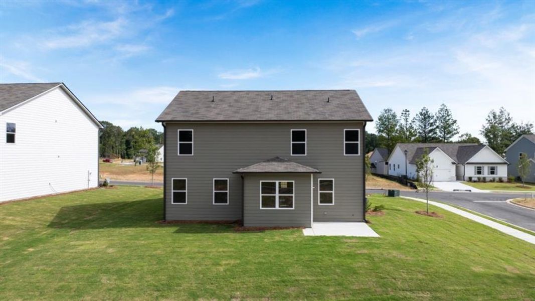 Front exterior of a new home in Fairway 17 at Mirror Lake, Villa Rica, GA, highlighting curb appeal (Image 2).