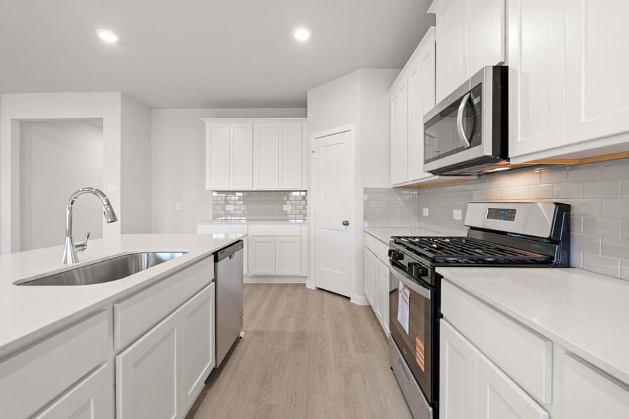 Furnished interior view inside a new home in Sunterra, Katy (Image 3).