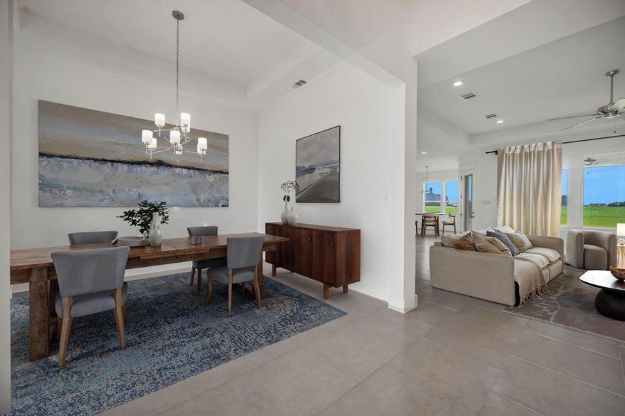 Dining room with recessed lighting, tile patterned floors, a notable chandelier, and plenty of natural light Dining room with recessed lighting, tile patterned floors, a notable chandelier, and plenty of natural light