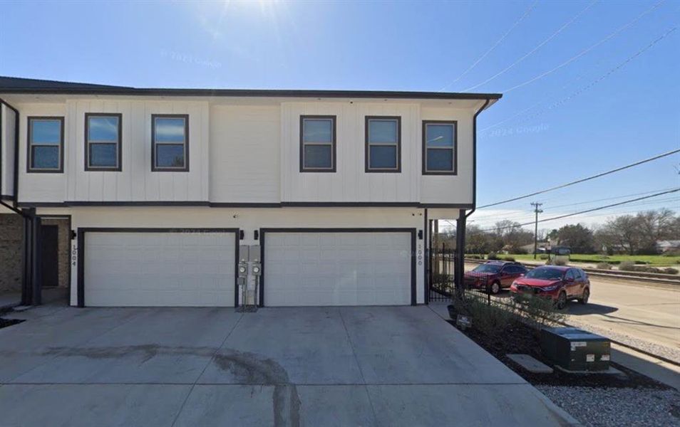 View of front of property with a garage & concrete driveway View of front of property with a garage & concrete driveway