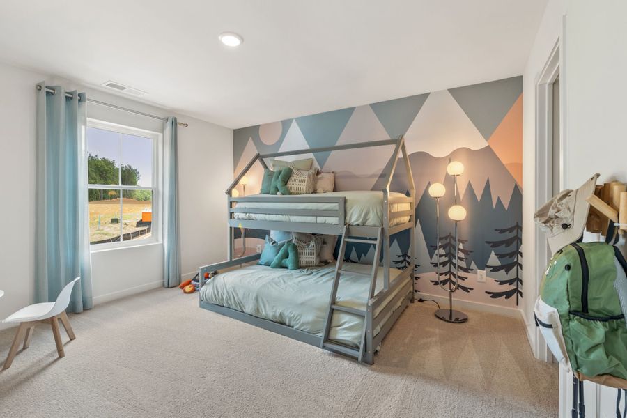 A bedroom with a bed and a chair. A bedroom with a bed and a chair.