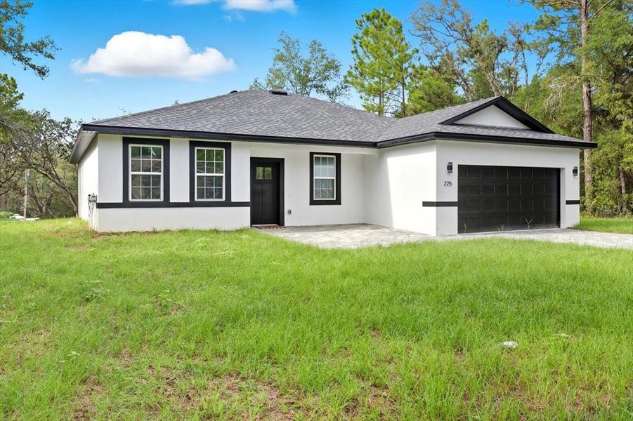 Front exterior of a new home in , Citrus Springs, FL, highlighting curb appeal (Image 21).