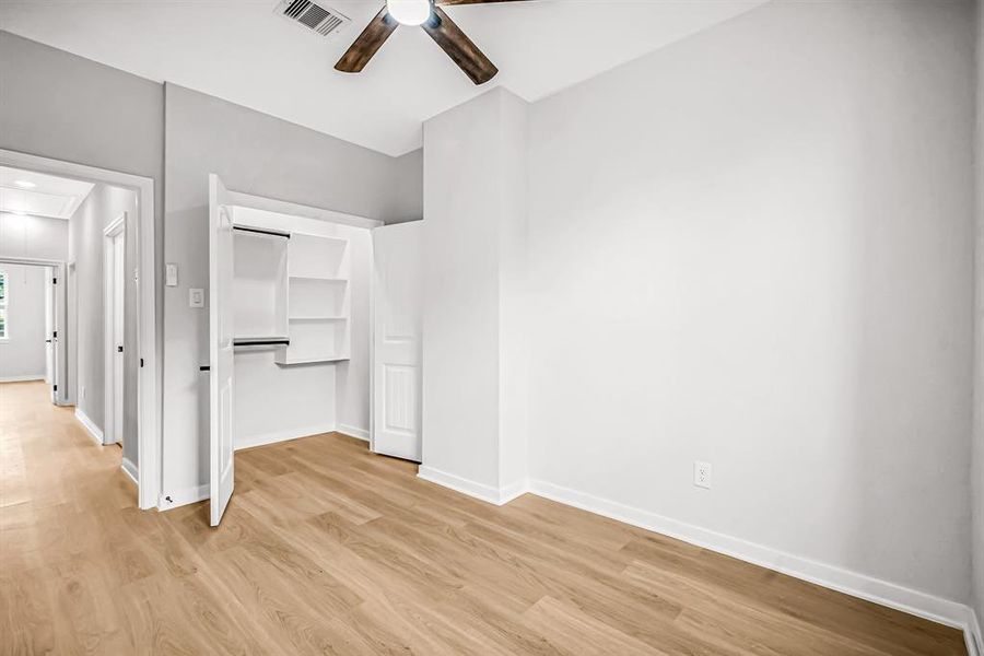 Guest bedroom with walk in closet.