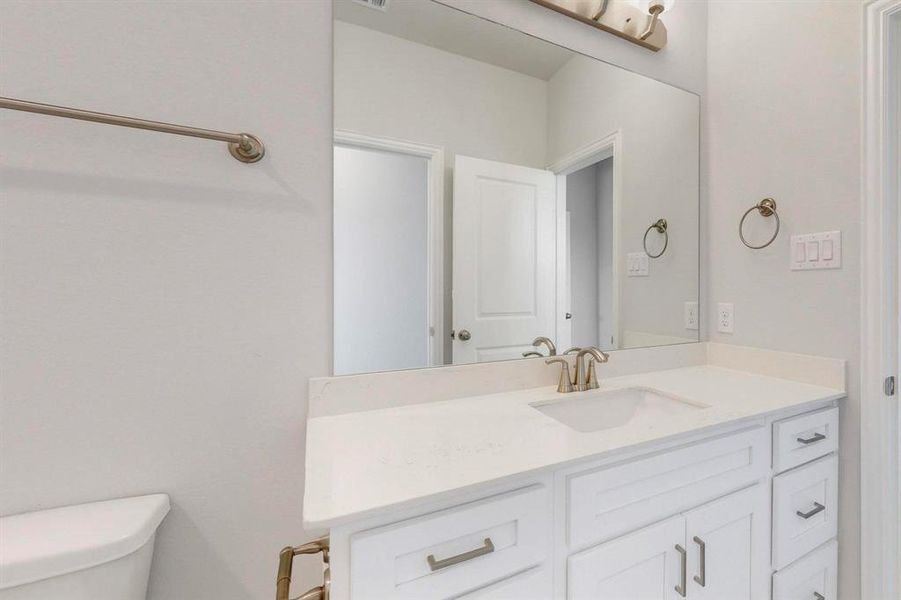 Bathroom with vanity and toilet