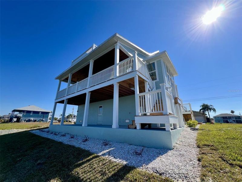 Exterior details and patio area of a home in , Hernando Beach (Image 31).