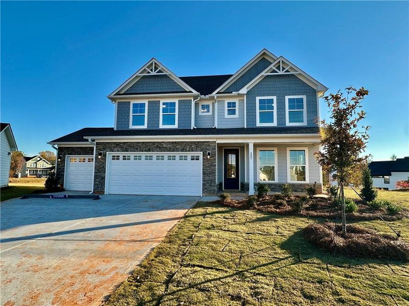 Front exterior of a new home in Twin Lakes, Hoschton, GA, highlighting curb appeal (Image 2).