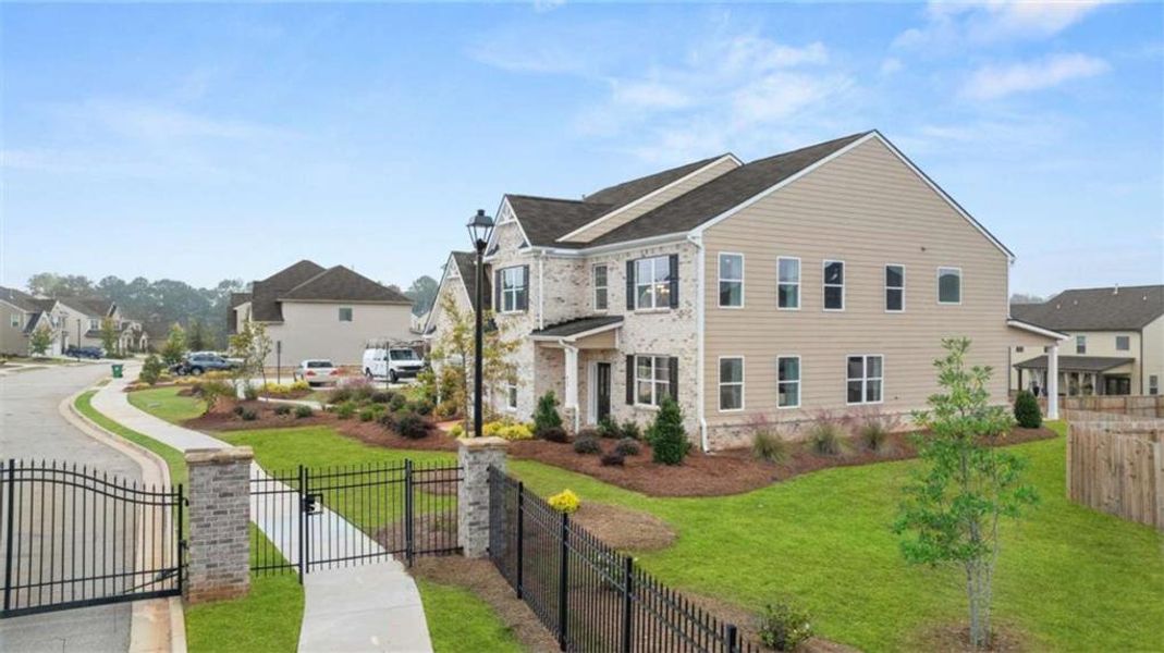 Front exterior of a new home in The Gates at Pates Creek, Hampton, GA, highlighting curb appeal (Image 23).