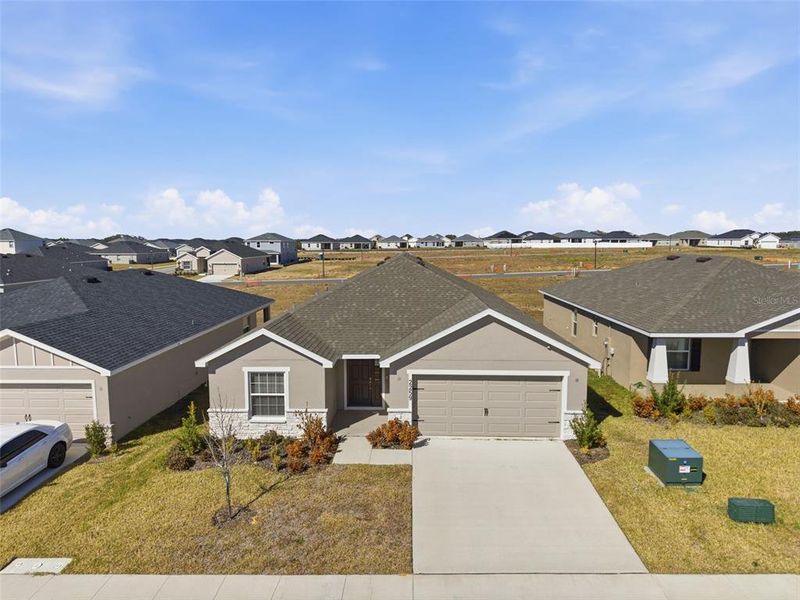 Front exterior of a new home in , Davenport, FL, highlighting curb appeal (Image 27).